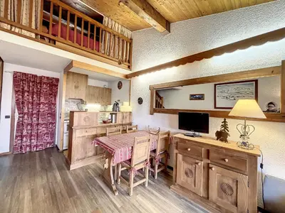 a dining room with a table and a desk at Studio mezzanine au centre de Combloux avec parking - FR-1-560-123 in Combloux