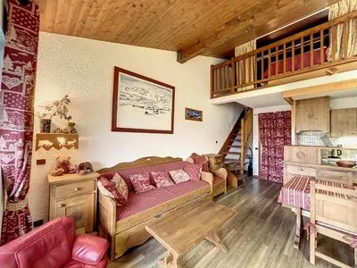 a living room with a couch and a loft at Studio mezzanine au centre de Combloux avec parking - FR-1-560-123 in Combloux