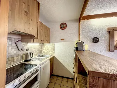 a kitchen with a sink and a stove top oven at Studio mezzanine au centre de Combloux avec parking - FR-1-560-123 in Combloux