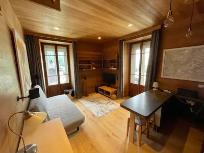 a living room with a couch and a table at 10 Bel-Alp in Chamonix-Mont-Blanc