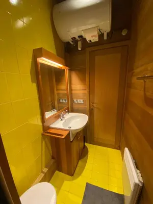 a small bathroom with a sink and a toilet at 10 Bel-Alp in Chamonix-Mont-Blanc