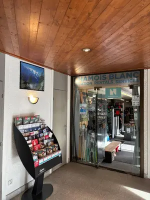 a store front with a sign on the wall at Chamois blanc / Chamonix in Chamonix-Mont-Blanc