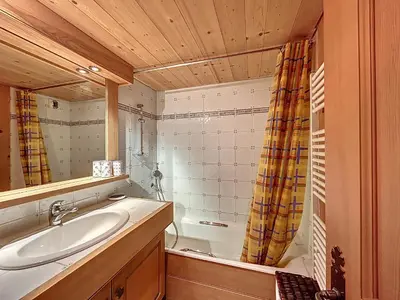a bathroom with a sink and a bath tub at Appartement 2 chambres avec parking et wifi à Combloux - FR-1-560-124 in Combloux