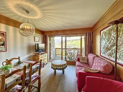a living room with a couch and a table at Appartement 2 chambres avec parking et wifi à Combloux - FR-1-560-124 in Combloux
