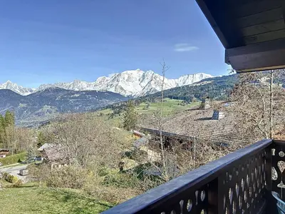 a view of snowy mountains from a balcony at Appartement avec garage proches ski bus à Combloux - FR-1-560-126 in Combloux
