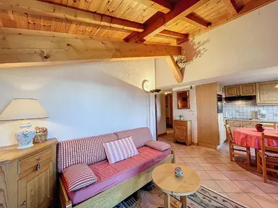 a living room with a couch and a table at Appartement avec garage proches ski bus à Combloux - FR-1-560-126 in Combloux