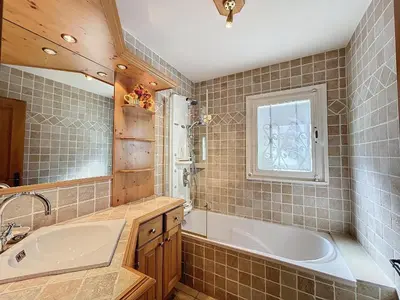 a bathroom with a tub and a sink at Chalet 9 personnes à Combloux, Mont Blanc - FR-1-560-125 in Combloux