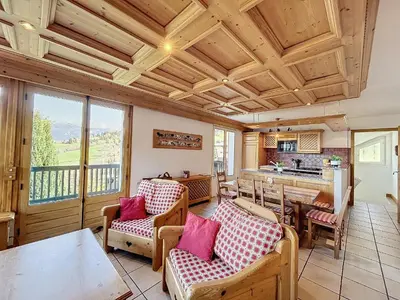 a living room with a table and chairs at Chalet 9 personnes à Combloux, Mont Blanc - FR-1-560-125 in Combloux