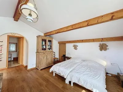 a bedroom with a bed and a wooden floor at Chalet 9 personnes à Combloux, Mont Blanc - FR-1-560-125 in Combloux