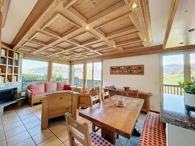 a living room with a wooden table and chairs at Chalet 9 personnes à Combloux, Mont Blanc - FR-1-560-125 in Combloux