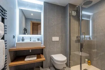 a bathroom with a toilet and a sink and a shower at Megève appartement 4 pièces résidence de standing in Megève