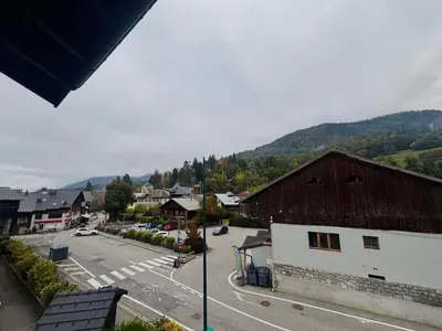 a group of chairs sitting on a porch at Confortable Appartement T3 au Centre avec Animaux admis - FR-1-624-158 in Samoëns