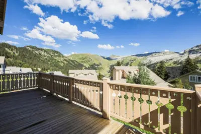 a deck with a view of mountains at Les Chalets de Flaine Hameau - maeva Home - Chalet 7 Pièces 12 Personnes - Prestige MAE-3379 in Flaine