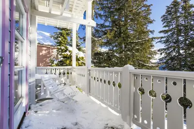 a porch with snow covered chairs on a house at Les Chalets de Flaine Hameau - maeva Home - Chalet 4 Pièces 8 Personnes - Sélection MAE-3386 in Flaine