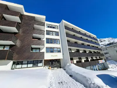 a hotel in the snow in front of a building at Résidence Pégase - maeva Home - Appartement 3 pièces 8 personnes Confort MAE-3481 in Flaine