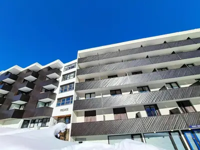 an apartment building with snow in front of it at Résidence Pégase - maeva Home - Appartement 3 pièces 8 personnes Confort MAE-3481 in Flaine