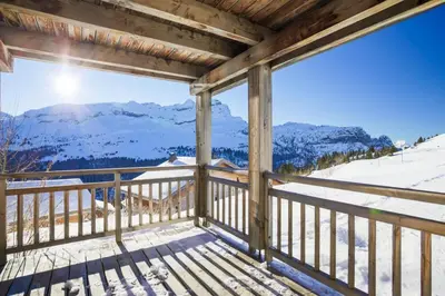a balcony with a view of a snow covered mountain at Résidence Refuge du Golf - maeva Home - Appartement 2 pièces 4 personnes Prestige MAE-3482 in Arâches-la-Frasse