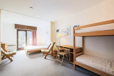 a bedroom with a bunk bed and a desk at Résidence Andromède - maeva Home - Appartement 2 pièces 6 personnes Confort MAE-3514 in Flaine