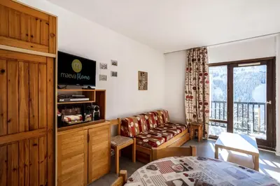 a living room with a couch and a television at Résidence Andromède - maeva Home - Studio 4 personnes Confort MAE-3516 in Flaine