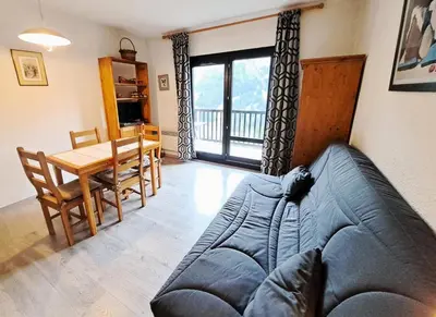 a living room with a couch and a table at Résidence Andromède - maeva Home - Studio 4 Personnes - Confort MAE-3649 in Flaine