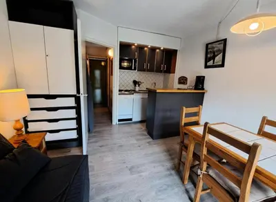 a kitchen and a living room with a table and a dining room at Résidence Andromède - maeva Home - Studio 4 Personnes - Confort MAE-3649 in Flaine