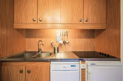 a kitchen with a sink and a dishwasher at Résidence Andromède - maeva Home - Studio 4 Personnes - Confort MAE-3650 in Flaine