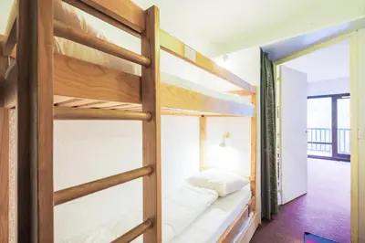 a bedroom with bunk beds in a hostel at Résidence Andromède - maeva Home - Studio 4 Personnes - Confort MAE-3650 in Flaine