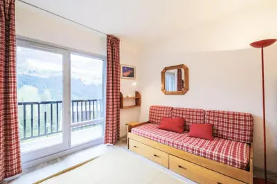 a living room with a couch and a large window at Résidence Andromède - maeva Home - Studio 4 Personnes - Confort MAE-3651 in Flaine