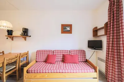 a living room with a couch and a table at Résidence Andromède - maeva Home - Studio 4 Personnes - Confort MAE-3651 in Flaine