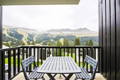 a table and chairs on a balcony with a view at Résidence Andromède - maeva Home - Studio 4 Personnes - Budget MAE-3652 in Flaine