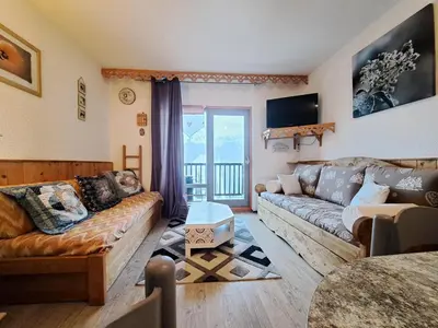 a living room with a couch and a table at Résidence Andromède - maeva Home - Studio 4 Personnes - Confort MAE-3653 in Flaine