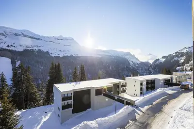 a building in the snow with mountains in the background at Résidence Andromède - maeva Home - Studio 4 Personnes - Confort MAE-3653 in Flaine