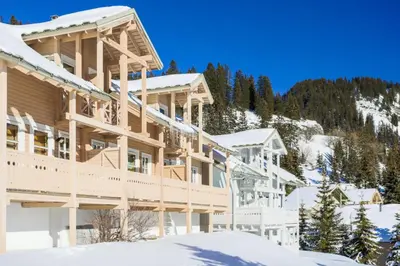 a large wooden house in the snow at Les Chalets de Flaine Hameau - maeva Home - Chalet 3 Pièces 8 Personnes - Confort MAE-3654 in Flaine