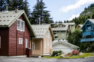 a row of houses in a village at Les Chalets de Flaine Hameau - maeva Home - Chalet 5 Pièces 8 Personnes - Prestige MAE-3655 in Flaine