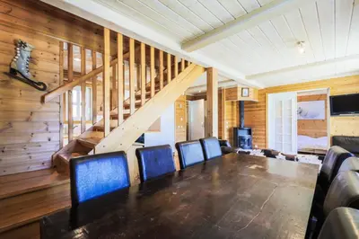 a dining room with a large table and chairs at Les Chalets de Flaine Hameau - maeva Home - Chalet 5 Pièces 8 Personnes - Confort MAE-3661 in Flaine