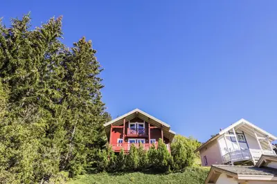 a house on a hill with trees at Les Chalets de Flaine Hameau - maeva Home - Chalet 4 Pièces 8 Personnes - Confort MAE-3662 in Flaine