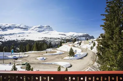 a view of a ski resort with snow covered mountains at Les Chalets de Flaine Hameau - maeva Home - Chalet 4 Pièces 8 Personnes - Confort MAE-3662 in Flaine