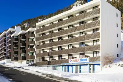 a building in the snow with a sign in front at Résidence Pégase - maeva Home - Appartement 3 Pièces 8 personnes - Sélection MAE-3663 in Flaine