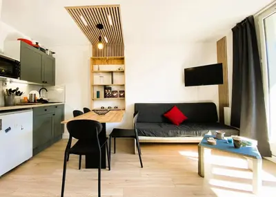a small living room with a couch and a table at Résidence Pégase - maeva Home - Studio 4 Personnes - Budget MAE-3664 in Flaine