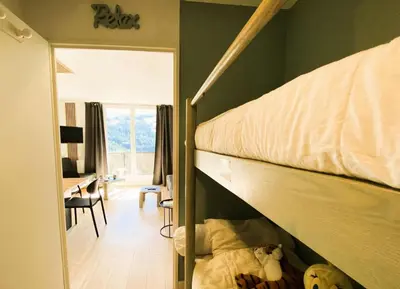 a bedroom with a bunk bed and a desk at Résidence Pégase - maeva Home - Studio 4 Personnes - Budget MAE-3664 in Flaine