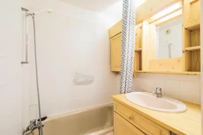 a bathroom with a sink and a tub at Résidence Arche - maeva Home - Studio 4 Personnes - Confort MAE-3695 in Arâches-la-Frasse