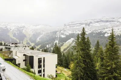 a building on the side of a mountain with snow at Résidence Arche - maeva Home - Studio 4 Personnes - Confort MAE-3695 in Arâches-la-Frasse
