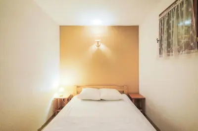 a bedroom with a bed with two pillows on it at Résidence Arche - maeva Home - Studio 4 Personnes - Confort MAE-3695 in Arâches-la-Frasse