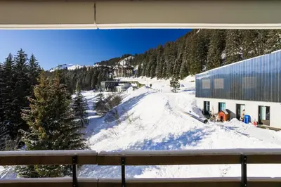 a view of a snow covered mountain from a window at Résidence Arche - maeva Home - Appartement 2 Pièces 6 Personnes - Confort MAE-3696 in Arâches-la-Frasse