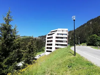 a building on the side of a hill with a street light at Résidence Arche - maeva Home - Appartement 2 Pièces 6 Personnes - Confort MAE-3696 in Arâches-la-Frasse