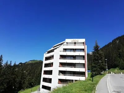 a white apartment building on the side of a road at Résidence Arche - maeva Home - Studio 4 Personnes - Confort MAE-3697 in Arâches-la-Frasse