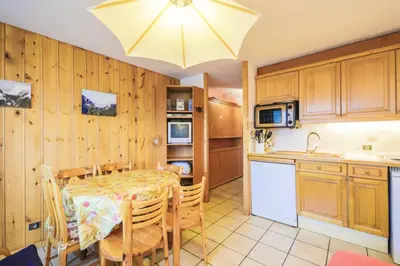 a kitchen with a table and a dining room at Résidence Arche - maeva Home - Studio 4 Personnes - Confort MAE-3697 in Arâches-la-Frasse