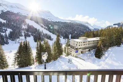 a building on top of a snow covered mountain at Résidence Aldébaran - maeva Home - Appartement 2 Pièces 6 Personnes - Prestige MAE-3791 in Arâches-la-Frasse