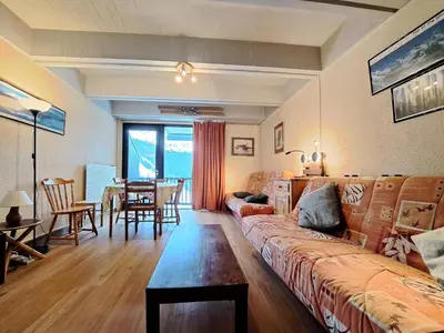 a living room with a couch and a table at Résidence Aldébaran - maeva Home - Appartement 2 Pièces 6 Personnes - Budget MAE-3792 in Arâches-la-Frasse