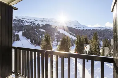 a balcony with a view of a snow covered mountain at Résidence Aldébaran - maeva Home - Appartement 2 Pièces 6 Personnes - Confort MAE-3806 in Arâches-la-Frasse